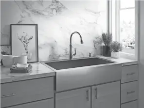  ?? KOHLER ?? Farmhouse or apron-front kitchen sinks are well known for their rustic beauty.