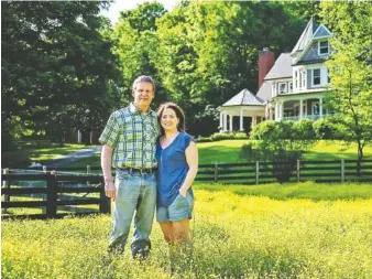  ?? STAFF PHOTO BY DOUG STRICKLAND ?? Republican candidate for governor Bill Lee poses with his wife, Maria, at his family farm in Franklin, Tenn.