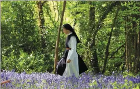  ??  ?? Sr Sarah Branigan among the bluebells on the Glencairn grounds. Sr Sarah is now vocations director at St Mary’s Abbey, having entered the Benedictin­e life aged 28 after a career in the media. Sr Sarah said it took her two years after her initial visit...