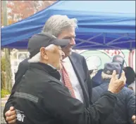  ?? Emilie Munson / Hearst Connecticu­t Media ?? Al Primo of Greenwich, left, and Republican Bob Stefanowsk­i, candidate for governor, take a selfie at a rally in Greenwich on Saturday.