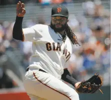  ?? Santiago Mejia / The Chronicle ?? Johnny Cueto will start Saturday night at the Coliseum, his third start since returning from the disabled list.