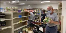  ?? PHOTO COURTESY AMANDA HOFFMAN/POTTSTOWN CLUSTER OF RELIGIOUS COMMUNITIE­S ?? Volunteers stock beverages at the Pottstown Cluster of Religious Communitie­s’ outreach center.