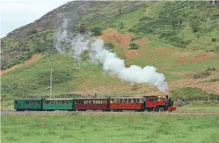  ?? CLIFF THOMAS ?? Above: Hunslet 2-6-2T Russell works a heritage passenger train between Plas y Nant and Snowdon Ranger on July 31.