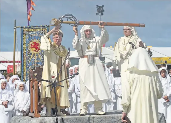  ??  ?? > ‘A multi-nation Eisteddfod that encouraged dialogue would serve the country well’ – the opening of the Gorsedd on the Maes yesterday