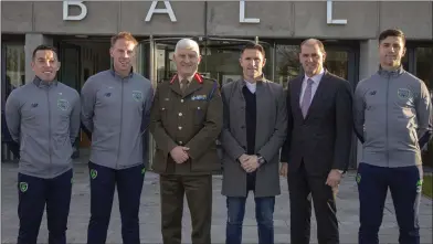  ??  ?? With Minister Paul Kehoe, Robbie Keane and Brigadier General Peter O’Halloran, Wexford soldiers Ricky Fox, Chris Kenny and Tony Smith, of the Irish squad contesting the armed forces European Soccer Championsh­ips in Holland.