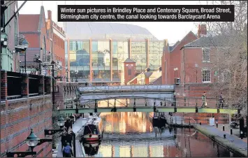  ??  ?? Winter sun pictures in Brindley Place and Centenary Square, Broad Street, Birmingham city centre, the canal looking towards Barclaycar­d Arena