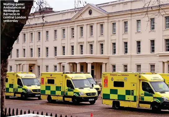  ?? ?? Waiting game: Ambulances at Wellington Barracks in central London yesterday