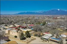  ?? MORGAN TIMMS/Taos News ?? The San Francisco de Asís Mission Church and surroundin­g Ranchos de Taos neighborho­ods as seen from above, Wednesday (March 31).