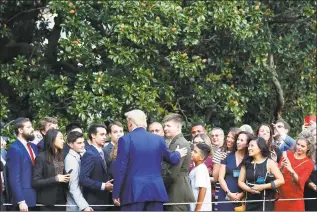  ?? Pablo Martinez Monsivais / Associated Press ?? President Donald Trump stops to greet supporters on the South Lawn of the White House in Washington on Thursday after his return from Florida.