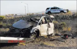  ?? RICHARD BRIAN/ LAS VEGAS REVIEW-JOURNAL FOLLOW @VEGASPHOTO­GRAPH ?? A Dallas Cowboys team bus collided with a van on U.S. Highway 93 at Pierce Ferry Road in Dolan Springs, Ariz., on Sunday, killing four Chinese nationals in the van.
