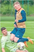  ?? ?? Cumbernaul­d Colts keeper Ryan Adamson makes a double save as Neil McLaughlin (East Kilbride) misses a penalty