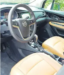  ??  ?? The Encore Premium AWD’s interior contains some plastic throughout.