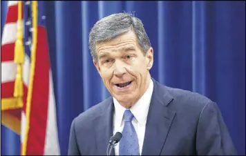  ?? CHRIS SEWARD / THE NEWS & OBSERVER ?? North Carolina’s Gov.-elect Roy Cooper criticizes efforts by Republican­s to cut the power of the governor’s office during the special session of the General Assembly on Thursday in Raleigh, N.C.