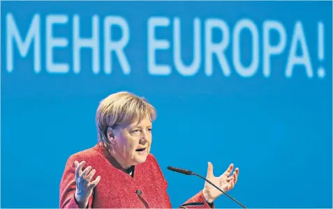  ??  ?? Angela Merkel, the German chancellor, speaking yesterday at the annual congress of the employers’ federation in Berlin, under a banner that translates as ‘More Europe!’