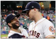  ?? AP/DAVID J. PHILLIP ?? Houston Astros third baseman Alex Bregman (right) jokes with Jose Altuve after they both were presented with their All-Star jerseys before Thursday’s game against the Oakland Athletics. Bregman, in his third season in the majors, is a first time...