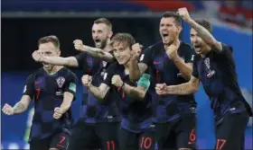  ?? MANU FERNANDEZ — THE ASSOCIATED PRESS ?? Croatia celebrates its win over Russia on July 7. The win was the second in the span of a week for Croatia that came via penalty kicks after 120 minutes of action.
