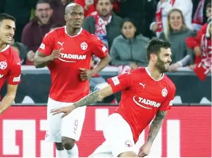  ?? (Danny Maron) ?? HAPOEL BEERSHEBA midfielder Hanan Maman (right) celebrates after scoring one of his two goals in last night’s 3-0 win over Maccabi Petah Tikva at Turner Stadium.