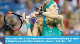  ??  ?? MASON: Petra Kvitova of Czech Republic returns a shot to Serena Williams during the Western &amp; Southern Open at Lindner Family Tennis Center on Tuesday in Mason, Ohio. — AFP