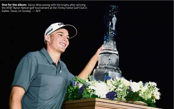  ??  ?? One for the album: Aaron Wise posing with the trophy after winning the AT&T Byron Nelson golf tournament at the Trinity Forest Golf Club in Dallas, Texas, on Sunday. — AFP