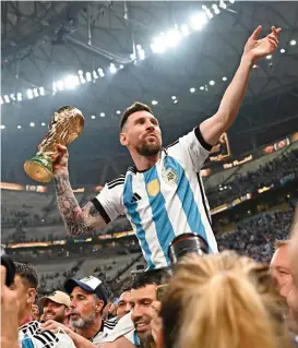  ?? (AFP) ?? Argentina captain Lionel Messi holds the FIFA World Cup Trophy after the Qatar 222 World Cup final at Lusail Stadium last December