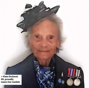  ?? ?? Kate Orchard, 99, proudly wears her medals