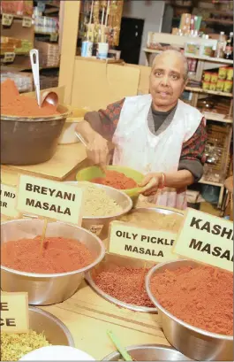  ??  ?? Harrybhai’s Eastern Supermarke­t employee, Premilla Bira, shows off the variety of masala and spices. Pictures: Zanele Zulu / African News Agency (ANA)