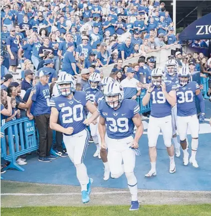 ?? GEORGE FREY/AP ?? Built Brands will give the opportunit­y for all 123 members of the BYU football team to be paid to promote its products.