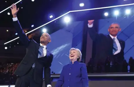  ?? ROBYN BECK/AFP/GETTY IMAGES FILE PHOTO ?? U.S. President Barack Obama with Hillary Clinton at the July U.S. Democratic National Convention. Since then, he has been an avid campaign supporter.