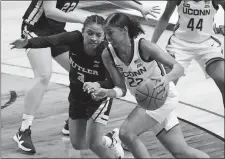  ?? DAVID BUTLER II/POOL PHOTO/AP PHOTO ?? UConn guard Evina Westbrook (22) drives against Butler guard Annilia Dawn (3) in the first half of Tuesday’s game in Storrs.