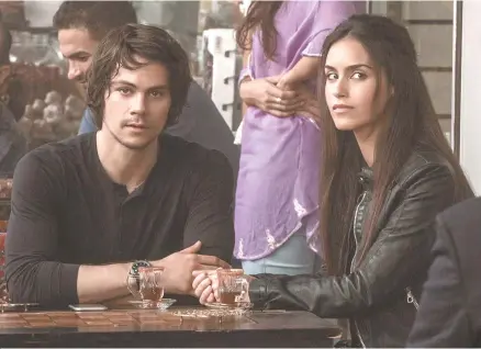  ?? Star Tribune-Tribune News ?? Dylan O’Brien, left, and Shiva Negar in “American Assassin”