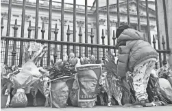  ?? JUSTIN TALLIS/AFP VIA GETTY IMAGES ?? Word of Prince Philip’s death Friday brought crowds of subjects to Buckingham Palace in London.