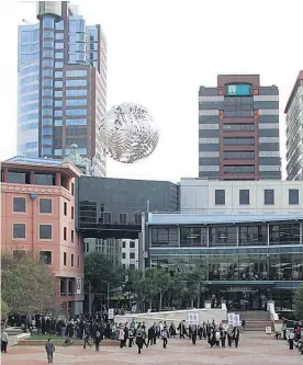  ?? Pictures/Getty Images, Tim McNamara ?? The striking Ferns sculpture which once hung high over Wellington’s Civic Square, is now in a waste management yard.