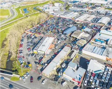  ??  ?? The land at 325A-327 Great South Rd has eight garage/ warehouse-style buildings; it is beside Fletcher Living’s upmarket Waiata Shores residentia­l enclave.