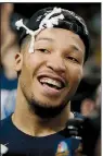  ?? AP/CHARLES KRUPA ?? Villanova’s Jalen Brunson celebrates after cutting a piece of net after the team’s victory over Texas Tech on Sunday.