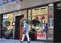  ??  ?? A picture shows the facade of the French restaurant L’Atelier de Joel Robuchon in London.