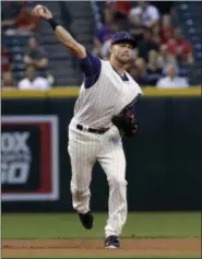  ?? MATT YORK — THE ASSOCIATED PRESS ?? Arizona Diamondbac­ks Chris Owings throws against the San Francisco Giants during the first inning of a baseball game, Thursday, in Phoenix.