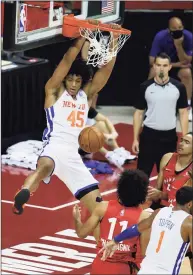  ?? Ethan Miller / Getty Images ?? Jericho Sims of the New York Knicks dunks against the Toronto Raptors during the NBA Summer League at the Thomas & Mack Center on Aug. 8 in Las Vegas. The Raptors defeated the Knicks 89-79.