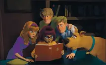  ?? WARNER BROS. ?? Clockwise from left, Daphne (voiced by Amanda Seyfried), Shaggy (Will Forte), Fred (Zac Efron), Scooby (Frank Welker) and Velma (Gina Rodriguez) — probe a mystery in “Scoob!”