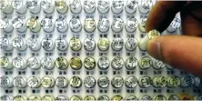  ?? AFP/File ?? A consumer chooses a ‘Hanko’ or personal seal in Tokyo.