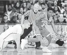  ??  ?? CASEY SAPIO, USA TODAY SPORTS UCLA guard Aaron Holiday, right, had two steals against Arizona in the Bruins’ 77-72 victory Saturday.