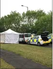  ??  ?? „ A white forensic tent at the scene of the shooting.