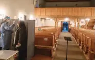  ?? (AFP) ?? A medical personal takes a swab for a rapid test for COVID-19 inside a protestant church in Stuttgart on Tuesday.