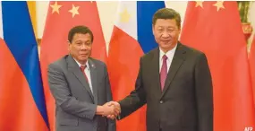  ??  ?? PRESIDENT Rodrigo R. Duterte (L) shakes hands with Chinese President Xi Jinping (R) prior to their bilateral meeting during the Belt and Road Forum for Internatio­nal Cooperatio­n at the Great Hall of the People in Beijing on May 15.