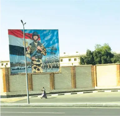  ??  ?? A POSTER touts Egyptian military might.