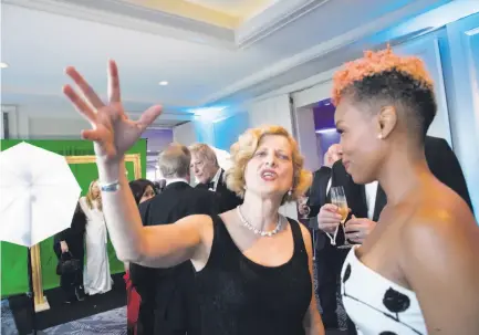  ?? Photos by Paul Kuroda / Special to The Chronicle ?? ACT Artistic Director Carey Perloff (left) speaks with alumna Anika Noni Rose at Perloff ’s retirement gala.