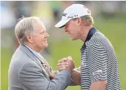  ?? REUTERS ?? Jack Nicklaus, left, shakes hands with 2011 Memorial winner Steve Stricker.