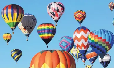  ?? JIM THOMPSON/JOURNAL ?? Travelers in New Mexico, drawn by such events as the Albuquerqu­e Internatio­nal Balloon Fiesta, racked up 35.4 million trips in 2017, 3 percent more than the previous year.