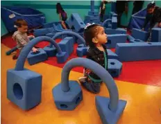  ?? Kin Man Hui / San Antonio Express-News ?? Klorissa Trevino, 3, has fun with giant building blocks at San Antonio’s DoSeum.