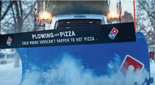  ?? PROVIDED BY DOMINO’S ?? Domino’s is helping select cities with $25,000 grants for snow plowing.