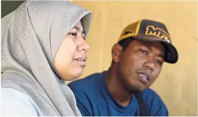  ??  ?? Grieving parents: Nur Daliia and husband Syabandi who lost their daughter Annur Sumayyah.